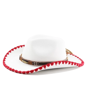Detail of white felt cowboy hat with red fringe trim and ethnic beaded feather band