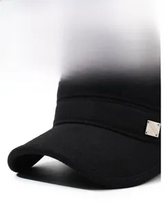 Detail of outdoor winter flat cap showing premium wool texture and fashion metal badge