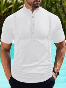 Detail of white short sleeve polo shirt featuring vertical pleats and standing collar