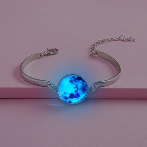 Luminous moon nebula bangle in silver finish with glowing blue gemstone and chain