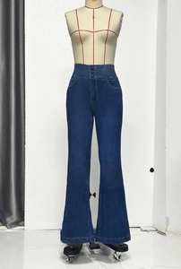 Detailed view of high-waist flared jeans with three-button closure and elastic waist
