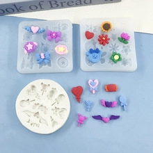 Detail of pink silicone bow and heart molds for chocolate and fondant cake decorating