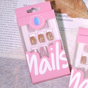 Nude pink cat eye press-on nails with sparkling glitter in a premium gift box