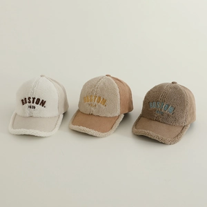 Three warm sherpa and corduroy Boston baseball caps in cream, light brown, and coffee