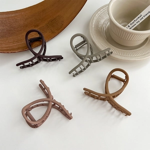 Set of four matte metal hair claws in deep brown and grey green for elegant hair styling