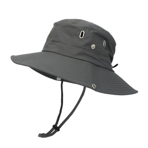 Detail view of dark grey wide brim sun hat with metal air vents and adjustable chin strap