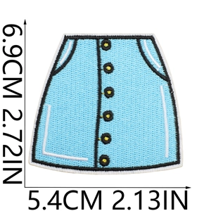Detailed embroidery patch of a blue skirt with white stitching and yellow buttons