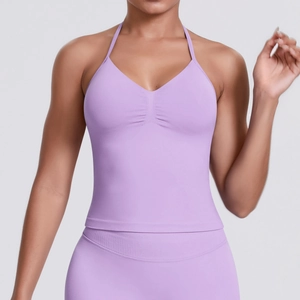 Detail of lavender halter sports top featuring seamless knit texture and chest pleats