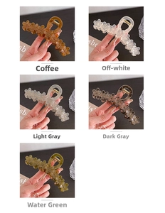 Detail of large flower-shaped jelly hair claws in five colors with metal springs