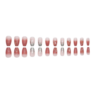 Coffin shaped press-on nails with red gradient finish and 3D fluid metal rhinestones