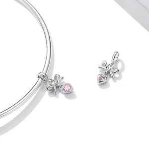 Polished S925 sterling silver bangle with pink heart-shaped crystal bow pendant