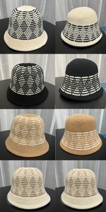 Detail view of wavy jacquard knit bucket hats in black, grey, khaki and beige colors