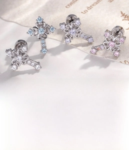 Detailed view of zircon cross stud earrings in four colors with steel screw flat backs