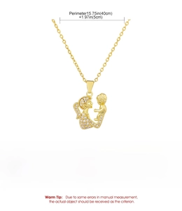 Detail view of gold mother and child pendant necklace with size and material specifications