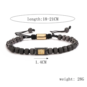 Detail of adjustable black beaded bracelet with gold rectangular charm and size specs
