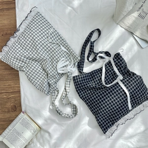 Flat lay of plaid tote bags featuring delicate lace trim and ruffled edges in canvas