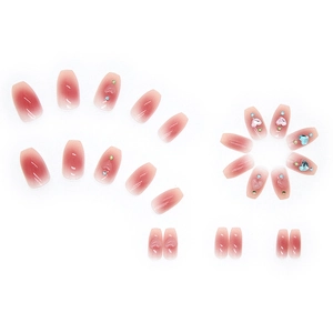 Pink gradient coffin press-on nails with 3D heart charms and colorful rhinestones