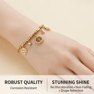 Detailed view of a gold-plated tree of life bracelet with sparkling zircon charms