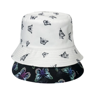 Dual-sided sun hat with butterfly print featuring black and white reversible fisherman caps