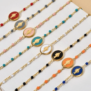 Religious stainless steel bracelet featuring colorful enamel Saint Mary charms in golden finish