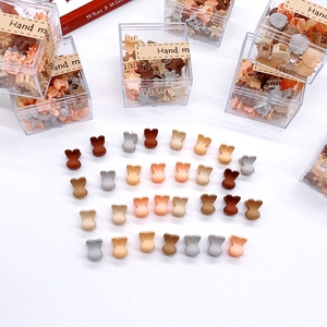 Detail of mini rabbit hair clips in matte Morandi colors with handmade gift box