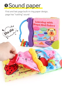 Detail of infant cloth book featuring crinkle sound paper and colorful fruit illustrations