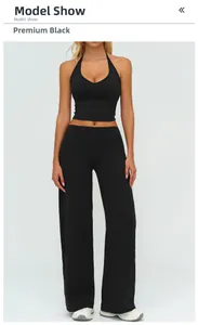 Detail of high-waist wide-leg pants and halter top in premium black yoga set