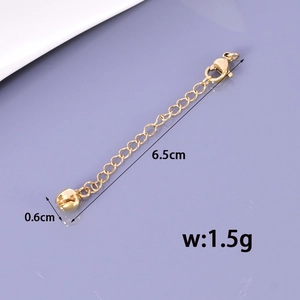 Detail of 6.5cm gold stainless steel extender chain with lobster clasp and round bell charm