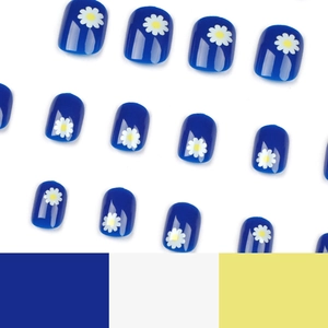 Short round blue press-on nails with white daisy floral design and glossy finish