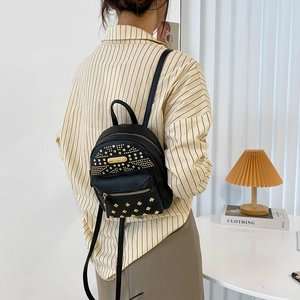 Punk style black PU leather backpack with gold studs and earphone hole for women