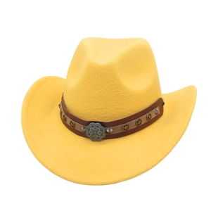 Close-up of yellow cowboy hat with brown leather band and vintage star metal ornament