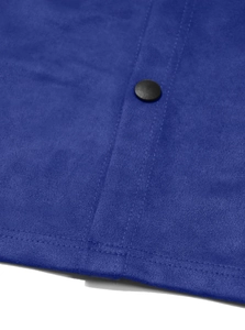 Detail of blue faux suede fabric featuring a black button and durable double stitching