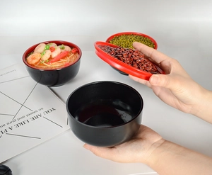 Japanese style red and black food bowl set shown as a versatile kitchen prop and organizer