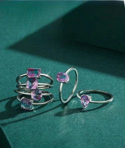 Macro detail of S925 sterling silver rings with multi-color gradient zircon gemstones