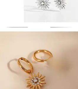 Detail view of high-polished gold and silver sunflower earrings with sparkling zircon stones