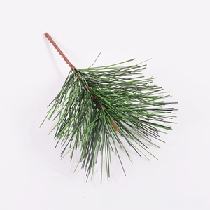 Detailed view of artificial green pine needle branch for DIY Christmas wreath decoration