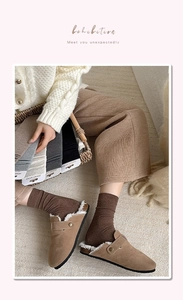 Close-up of ribbed cotton crew socks in neutral colors paired with shearling mules