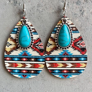 Ethnic teardrop wood earrings with geometric patterns and turquoise accents on grey stone