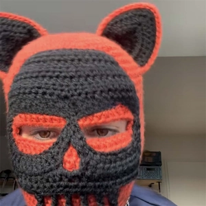 Close-up of handmade crochet balaclava with skeleton face and cat ear details