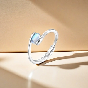 Close-up of S925 sterling silver ring with oval gemstone and visible hallmark engraving