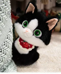 Detailed shot of cute tuxedo cat plush with green eyes and a strawberry collar