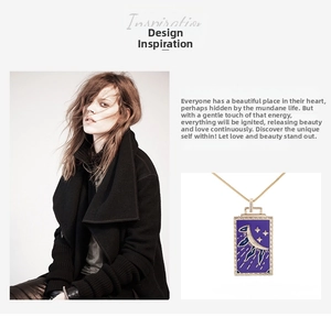 Detail of a tarot pendant necklace featuring a celestial gold crescent moon and star design