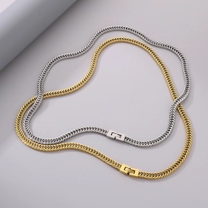 Detail of woven stainless steel Cuban dragon bone chains in gold and silver finishes