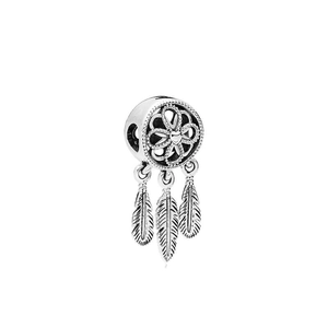 Silver dreamcatcher charm pendant with three feathers and intricate floral center detail