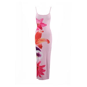 Detail of pink floral maxi dress featuring large red and purple lily prints and thin straps