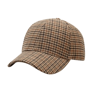 Detailed view of the textured brown houndstooth pattern and wool fabric on baseball cap