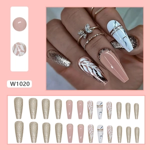 Long ballerina press-on nails with champagne gold glitter, marble patterns and leaf art