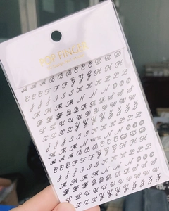 Detail of 3D cursive English letter nail stickers in gold and silver finish, model WG720
