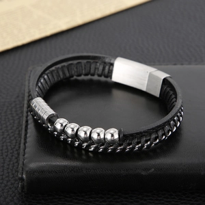Close-up of multi-layer leather braided bracelet with beads and steel magnetic clasp