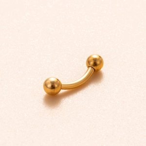 Titanium G23 curved barbell piercing in gold finish with two spherical bead ends